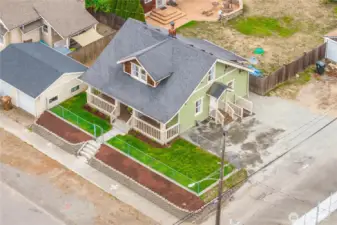Drone of home showing abundant parking and garage.