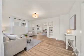 Living Room with all new LVP waterproof floors and new paint and trim throughout home.