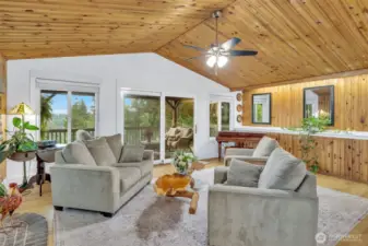 Main level living room with access to rear deck