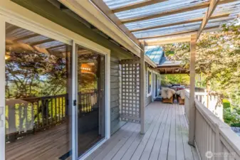 Rear deck off primary, connecting to Livingroom.