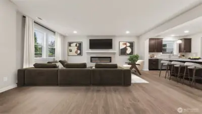 Spacious family room view from the 2nd entry area.  Actual home is under construction and materials, colors, and finishes will vary.  See site agent for details