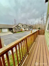 Side composite deck leading to backyard deck