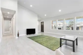 The large picture windows offer expansive views, natural light, and a strong outdoor connection.