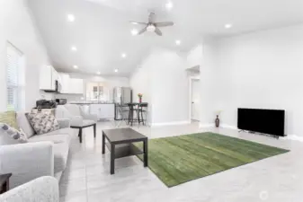 The open floor plan maximizes the use of space, creating a sense of spaciousness and allowing for easy flow between the kitchen and  living room.