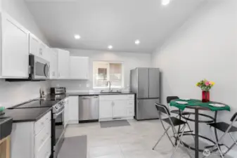 Plenty of counterspace and cupboards, offering ample storage and preparation areas in the kitchen.