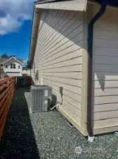 Side of home, showcasing a well-maintained and organized exterior.