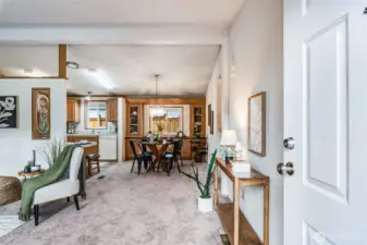 Enter to find a bright living space gleaming with new paint and flooring.