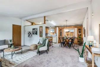 The living room flows seamlessly to the dining space and kitchen!