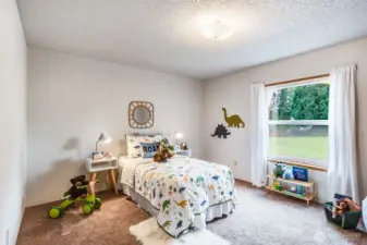 The second bedroom is a great size and looks out to the community park!