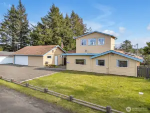 Two story home in Ocean Park with a detached garage & shop with ocean views.