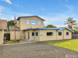 Two story home in Ocean Park with a detached garage & shop with ocean views.