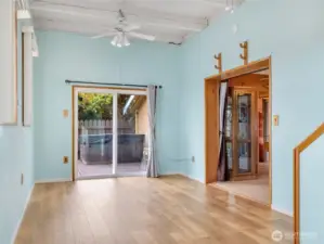 Dining area off the living room. This room leads you upstairs, or into the 3/4 bath with laundry space on the main floor. It also has a slider that will take you outside to the back porch.