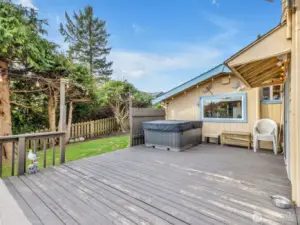 From the dining room slider out to the backyard. There is a large deck with hot tub as well as a spacious yard.