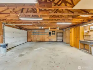 Large two car garage with work space.
