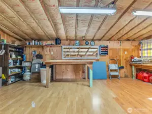 Large two car garage with work space.