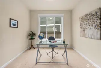 Versatile main-level room just off the kitchen--ideal for a home office, study, or quiet retreat.