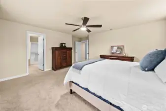 Another view of the expansive primary suite offering comfort, space, and a peaceful retreat.