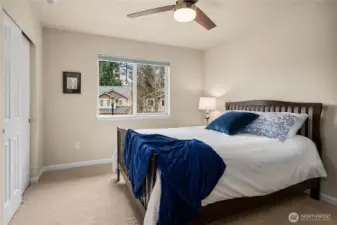 Bedroom 3: Comfortable bedroom filled with natural light and ample closet space.
