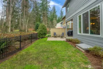 Fully fenced backyard with peaceful greenbelt setting and plenty of space to enjoy the outdoors.
