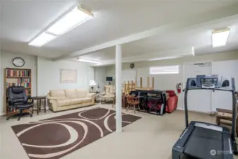 Large rec room in basement for Board meetings. Hallway on right side leads to saunas and bathrooms.