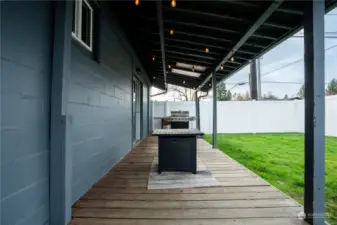 Perfectly sized back porch offers outdoor living space year round.