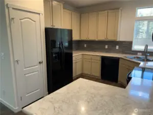 Another view of the kitchen and pantry.