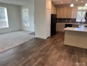 Looking at kitchen and great room from eating area/dining room.