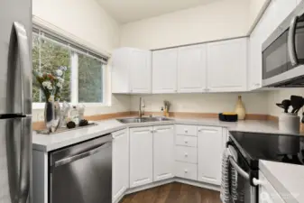 Stainless appliances and easy to work in this space.