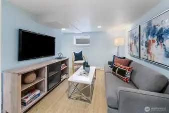 The finished lower level is ideal for guests with a separate exterior entrance and 3/4 bathroom!