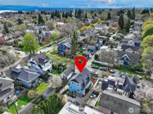 Note how this well proportioned home is set amongst beautifully restored and maintained homes. Looking southeast towards Lake Washington, St Joe's parish.