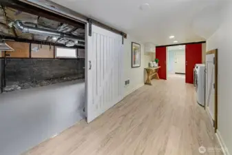Behind the barndoor is the utility room with the new 2024 heat pump - yes A/C and heat!