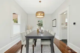The dining room that leads to the kitchen and the backyard.