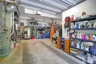 Large two car attached garage houses the furnace and newly installed hot water heater.