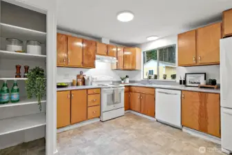 Spacious kitchen with ample cabinet storage and plenty of counter space.