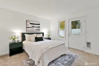 Comfortable primary bedroom with a private door to back yard space.