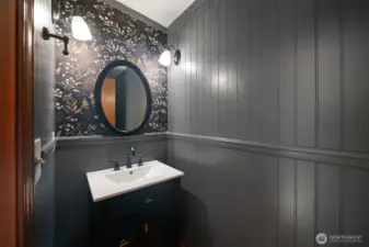 Updated powder room on the main floor, with stylish wainscoting walls, fresh paint, new vanity and fixtures