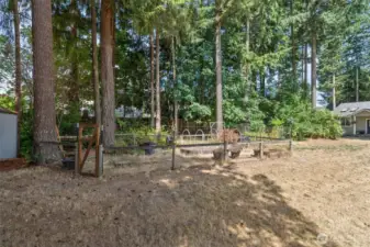 Lovely park-like setting features garden area and outbuilding