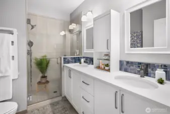 Primary bathroom fully remodeled with dual vanity and dual shower heads.