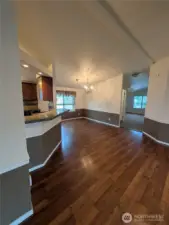 Living room flows nicely into the dining room and kitchen area. You could use the bar as a breakfast eating area, facing into the kitchen.