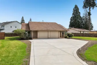 Front of duplex - extra large new concrete driveway