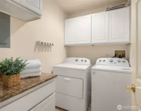 Large laundry room w/ extra storage & newer 2023 washer/dryer