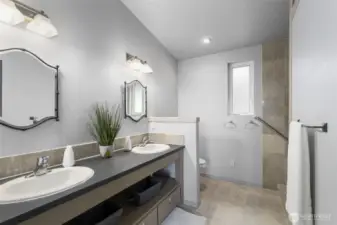 Primary bathroom with fully tiled shower