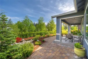 Expansive hardscape, and beautiful, mature landscaping. All with recently upgraded irrigation system. Generous covered porch with custom tile flooring is a lovely place to soak in the views.  Gas stub out for your BBQ.