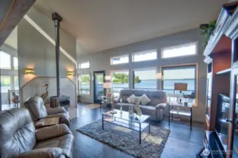 bright, airy living room with coastal elegance provide stunning water views of Totten and Little Skookum Inlet