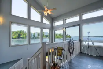 expansive water views framed by countless windows bringing in the serene beauty of the sound right indoors