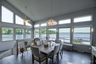 elegant dining with panoramic waterfront views and natural light-perfect for gatherings or peaceful morning coffee moments