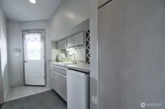 downstairs wet bar with wine storage, mini fridge and private entry-perfect for entertaining or guest convenience