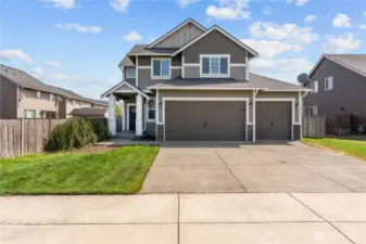 Front of the home, showcasing the three-car garage.