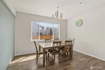 Dining area with access to your covered porch and large, fully-fenced backyard.