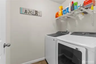 Utility room located on the second level of the home, outside of the bedrooms for quick access.
